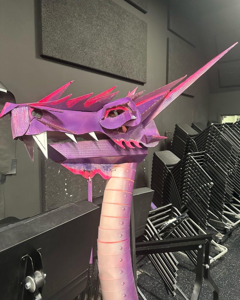 Read more about the article The full assembled dragon head and its somewhat cartoonishly oversized left hand